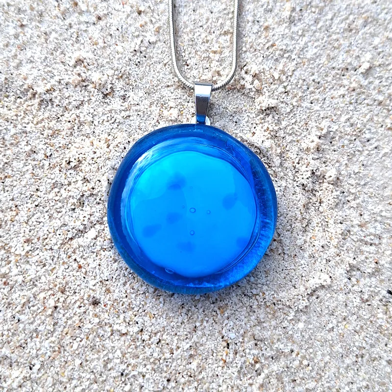 minimalist blue glass pendant for communication and clarity