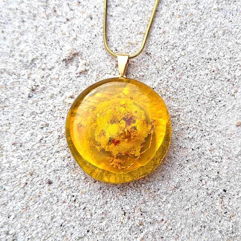 Sun pendant necklace, empowering jewelry for personal power.